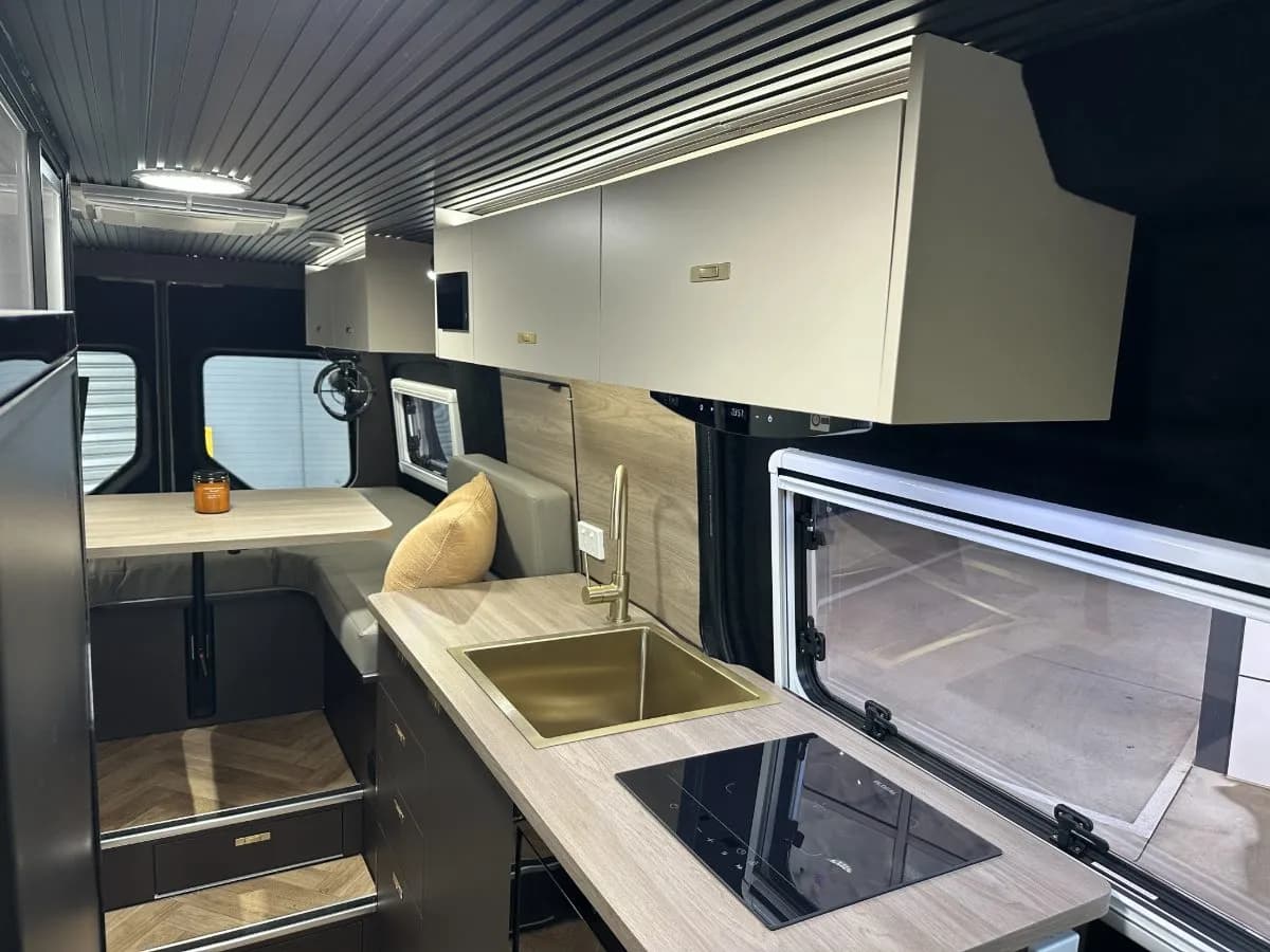 Strada galley with brass sink, induction cooktop and dinette